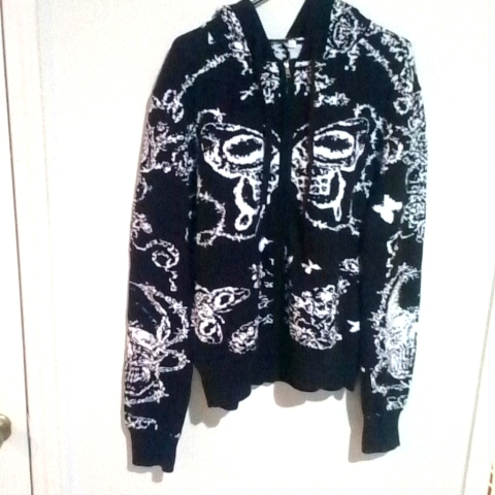 Poverty Label zip up sweater with hood.